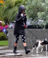 Nina_Dobrev_steps_out_and_braves_the_rain_to_take_her_dog_Maverick_out_for_a_walk_near_her_Los_Angeles_home_07.jpg